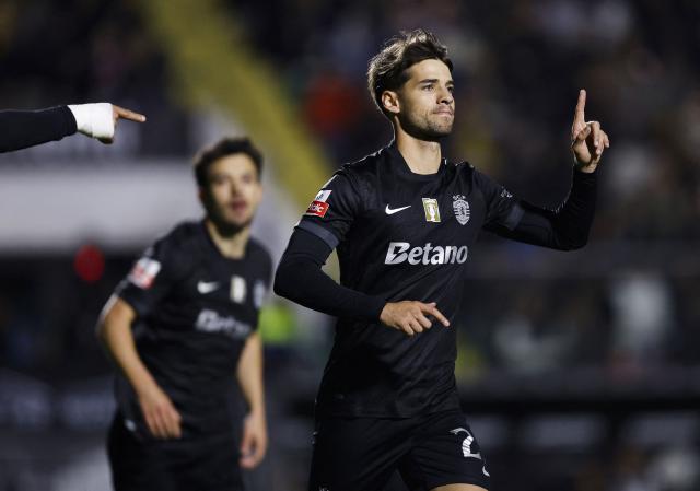 Sporting Lisbon's Portuguese midfielder #23 Daniel Braganca celebrates scoring his team's first goal during the Portuguese League football match between CF Estrela da Amadora and Sporting CP at Jose Gomes stadium in Amadora on April 11 , 2026. (Photo by FILIPE AMORIM / AFP)
