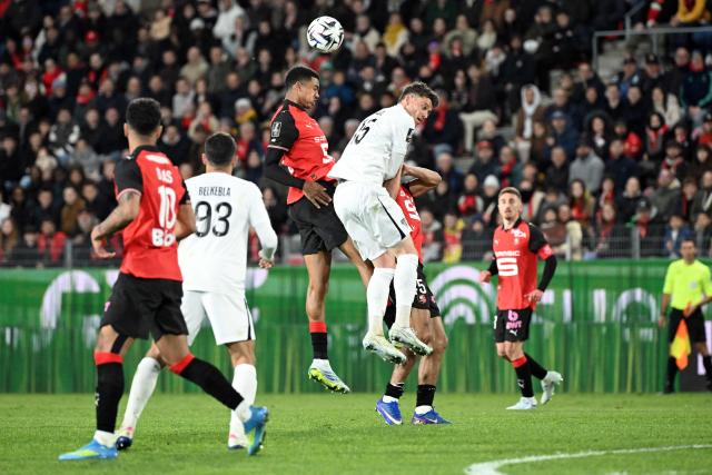 Rennes’ Moroccan defender #48 Ait Boudlal (C,L) heads the ball during the French L1 football match between Stade Rennais FC and SCO Angers at the Roazhon Park stadium in Rennes, western France, on April 11, 2026. (Photo by Sebastien Salom-Gomis / AFP)