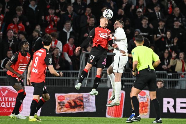 Rennes’ French midfielder #21 Valentin Rongier  heads the ball during the French L1 football match between Stade Rennais FC and SCO Angers at the Roazhon Park stadium in Rennes, western France, on April 11, 2026. (Photo by Sebastien Salom-Gomis / AFP)