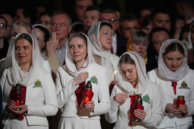 Orthodox believers attend the Orthodox Easter service at the Cathedral of Christ the Saviour in Moscow on April 12, 2026. (Photo by Alexander Zemlianichenko / POOL / AFP)