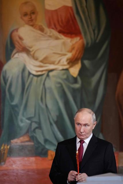 Russia's President Vladimir Putin attends the Orthodox Easter service at the Cathedral of Christ the Saviour in Moscow on April 12, 2026. (Photo by Alexander Zemlianichenko / POOL / AFP)