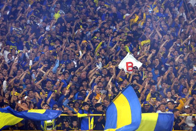 Boca Juniors fans cheer during the Argentine Professional Football League 2026 Apertura Tournament match between Boca Juniors and Independiente at La Bombonera Stadium in Buenos Aires on April 11, 2026. (Photo by Alejandro PAGNI / AFP)