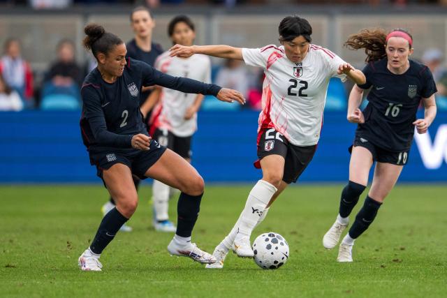 Japan midfielder #22 Remina Chiba is challenged by US forward #02 Trinity Rodman and US midfielder #16 Rose Lavelle during an international women's friendly football match between USA and Japan at PayPal Park in San Jose, California, on April 11, 2026. (Photo by Nic Coury / AFP)