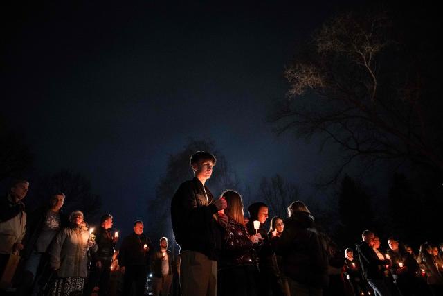 Orthodox believers hold candles as they takes part in midnight Easter Service at the Gracanica medieval monastery near Pristina, Kosovo, on April 12, 2026. (Photo by Armend NIMANI / AFP)
