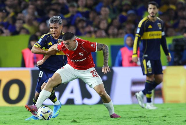 Boca Juniors' midfielder #18 Milton Delgado and Independiente's defender #22 Facundo Zabala fight for the ball during the Argentine Professional Football League 2026 Apertura Tournament match between Boca Juniors and Independiente at La Bombonera Stadium in Buenos Aires on April 11, 2026. (Photo by ALEJANDRO PAGNI / AFP)