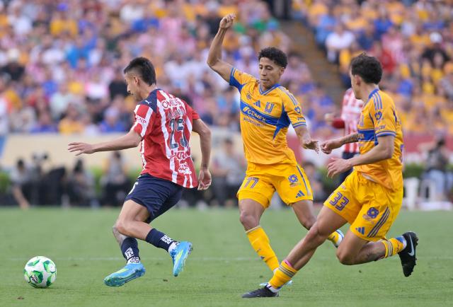 Guadalajara's forward #25 Roberto Alvarado, Tigres' forward #77 Ozziel Herrera and defender #33 Rafael Guerrero fight for the ball during the Liga MX Clausura tournament football match between Tigres and Guadalajara at the Universitario stadium in San Nicolas de los Garza, state of Nuevo Leon, Mexico, on April 11, 2026. (Photo by AFP)