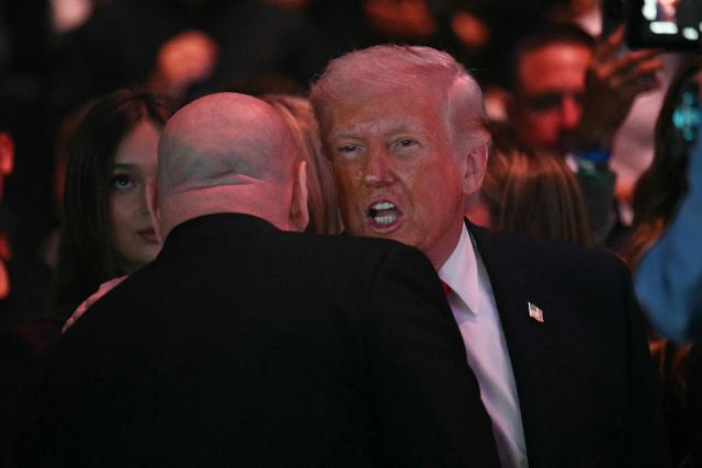 US President Donald Trump chats with UFC CEO and president Dana White before UFC 327: Jiri Prochazka vs Carlos Ulberg at Kaseya Center in Miami, on April 11, 2026. (Photo by Jim WATSON / AFP)