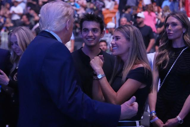 US President Donald Trump speaks with Kai Trump at UFC 327: Jiri Prochazka vs Carlos Ulberg at Kaseya Center in Miami, on April 11, 2026. (Photo by Julia Demaree Nikhinson / POOL / AFP)