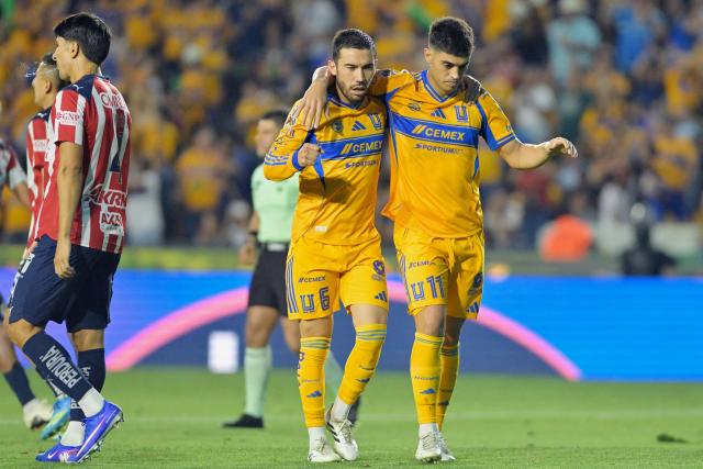 Tigres' Argentine midfielder #11 Juan Brunetta celebrates with teammate midfielder #06 Juan Pablo Vigon after scoring his team's fourth goal during the Liga MX Clausura tournament football match between Tigres and Guadalajara at the Universitario stadium in San Nicolas de los Garza, state of Nuevo Leon, Mexico, on April 11, 2026. (Photo by AFP)