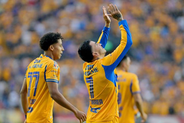 Tigres' Argentine forward #07 Angel Correa (R) celebrates next to teammate forward #77 Ozziel Herrera after scoring his team's third goal during the Liga MX Clausura tournament football match between Tigres and Guadalajara at the Universitario stadium in San Nicolas de los Garza, state of Nuevo Leon, Mexico, on April 11, 2026. (Photo by AFP)