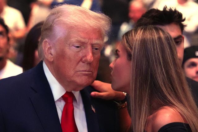 US President Donald Trump speaks with Kai Trump at UFC 327: Jiri Prochazka vs Carlos Ulberg at Kaseya Center in Miami, on April 11, 2026. (Photo by Julia Demaree Nikhinson / POOL / AFP)