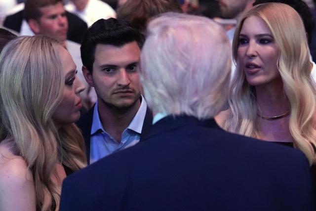 US President Donald Trump speaks with (L-R) Tiffany Trump, Michael Boulos and Ivanka Trump at UFC 327: Jiri Prochazka vs Carlos Ulberg at Kaseya Center in Miami, on April 11, 2026. (Photo by Julia Demaree Nikhinson / POOL / AFP)