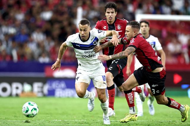 Monterrey's Spanish midfielder #10 Sergio Canales and Atlas' Brazilian forward #03 Gustavo Ferrareis fight for the ball during the Liga MX Clausura tournament football match between Atlas and Monterrey at the Jalisco stadium in Guadalajara, state of Jalisco, Mexico, on April 11, 2026. (Photo by Ulises Ruiz / AFP)