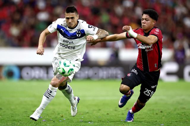 Monterrey's Montenegrin forward #20 Uros Djurdevic and Atlas' forward #251 Luis Gamboa fight for the ball during the Liga MX Clausura tournament football match between Atlas and Monterrey at the Jalisco stadium in Guadalajara, state of Jalisco, Mexico, on April 11, 2026. (Photo by Ulises Ruiz / AFP)