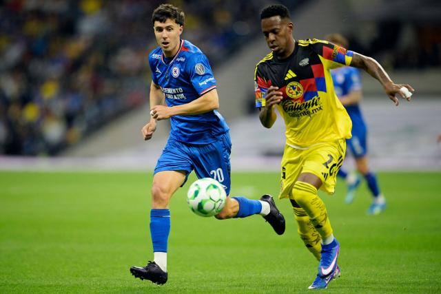Cruz Azul's Argentine forward #20 Jose Paradela and America's Colombian defender #26 Cristian Borja fight for the ball during the Liga MX Clausura tournament football match between America and Cruz Azul at the Azteca stadium in Mexico City, on April 11, 2026. (Photo by Alfredo ESTRELLA / AFP)