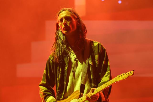 US guitarist Nick Valensi from the Strokes performs on the Coachella stage during the 2026 Coachella Valley Music and Arts Festival in Indio, California on April 11, 2026. (Photo by VALERIE MACON / AFP)