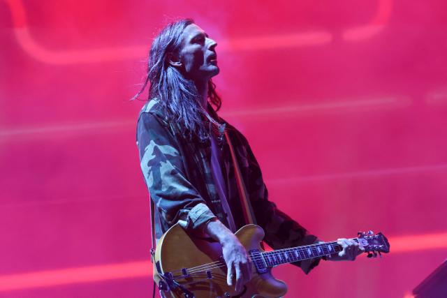 US guitarist Nick Valensi from the Strokes performs on the Coachella stage during the 2026 Coachella Valley Music and Arts Festival in Indio, California on April 11, 2026. (Photo by VALERIE MACON / AFP)