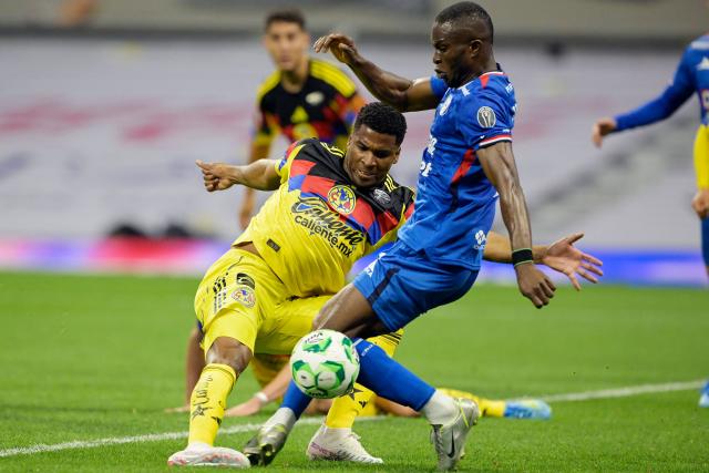 America's Colombian forward #19 Jose Raul Zuniga and Cruz Azul's Nigerian forward #11 Christian Ebere fight for the ball during the Liga MX Clausura tournament football match between America and Cruz Azul at the Azteca Stadium in Mexico City on April 11, 2026. (Photo by Alfredo ESTRELLA / AFP)