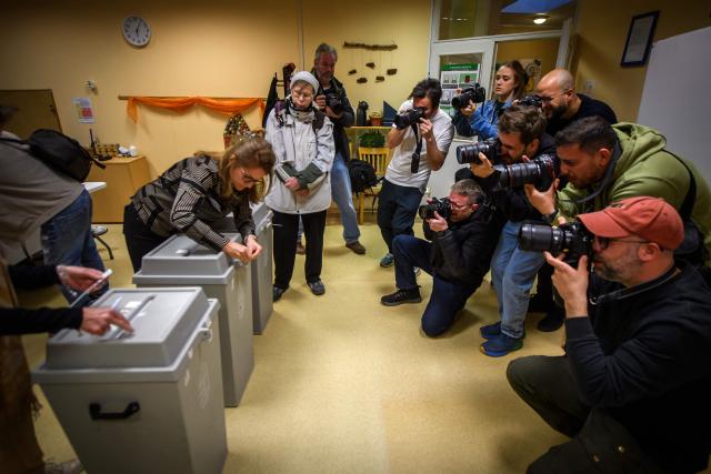 Ballot boxes are sealed in front of the eyes of photographers at a polling station in Budapest at the start of a general election in Hungary, on April 12, 2026. The vote could end Hungarian Prime Minister Viktor Orban's 16-year stint in power as the EU's longest serving current leader and a self-decribed "thorn" in the bloc's side. (Photo by Ferenc ISZA / AFP)