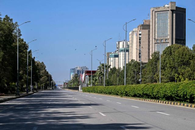 A deserted road is pictured after authorities restricted movement for the US-Iran peace talks in Islamabad on April 12, 2026. Iran and the United States failed to reach an agreement to end the war in the Middle East, US Vice President JD Vance said on April 12 after marathon talks in Islamabad, adding that he was leaving negotiations after giving Tehran the "final and best offer". (Photo by Farooq NAEEM / AFP)