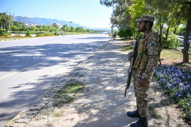 An army soldier stands guard at the Red Zone area after US-Iran peace talks in Islamabad on April 12, 2026. Iran and the United States failed to reach an agreement to end the war in the Middle East, US Vice President JD Vance said on April 12 after marathon talks in Islamabad, adding that he was leaving negotiations after giving Tehran the "final and best offer". (Photo by Farooq NAEEM / AFP)