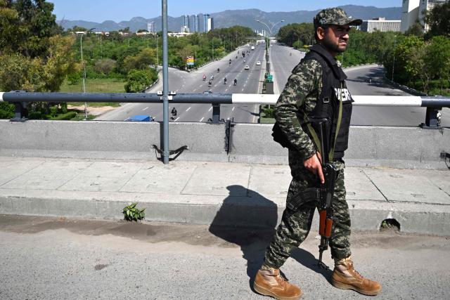 A paramilitary soldier keeps watch at a closed bridge after US-Iran peace talks in Islamabad on April 12, 2026. Iran and the United States failed to reach an agreement to end the war in the Middle East, US Vice President JD Vance said on April 12 after marathon talks in Islamabad, adding that he was leaving negotiations after giving Tehran the "final and best offer". (Photo by Aamir QURESHI / AFP)