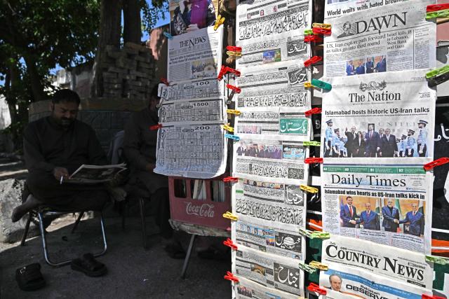 A man reads a morning newspaper at a roadside stall after US-Iran peace talks in Islamabad on April 12, 2026. Iran and the United States failed to reach an agreement to end the war in the Middle East, US Vice President JD Vance said on April 12 after marathon talks in Islamabad, adding that he was leaving negotiations after giving Tehran the "final and best offer". (Photo by Aamir QURESHI / AFP)