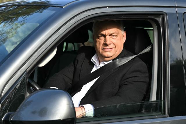 Hungary's nationalist Prime Minister Viktor Orban of the Fidesz party sits in his van as he leaves after voting at a polling station set up in a school in Budapest during a general election in Hungary, on April 12, 2026. The vote could end Hungarian Prime Minister Viktor Orban's 16-year stint in power as the EU's longest serving current leader and a self-decribed "thorn" in the bloc's side. (Photo by Attila KISBENEDEK / AFP)