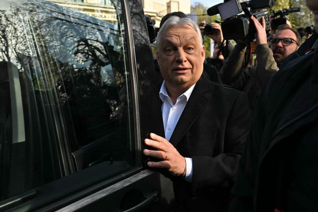 Hungary's nationalist Prime Minister Viktor Orban of the Fidesz party enters his van after voting at a polling station set up in a school in Budapest during a general election in Hungary, on April 12, 2026. The vote could end Hungarian Prime Minister Viktor Orban's 16-year stint in power as the EU's longest serving current leader and a self-decribed "thorn" in the bloc's side. (Photo by Attila KISBENEDEK / AFP)