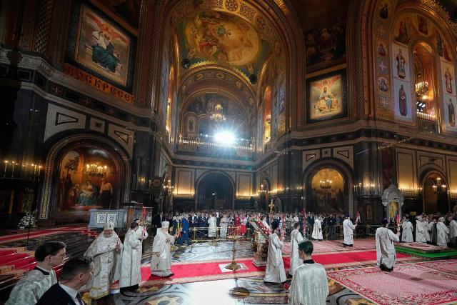 Russian Orthodox Patriarch Kirill (L) leads the Orthodox Easter service at the Cathedral of Christ the Saviour in Moscow on April 11, 2026. (Photo by Alexander Zemlianichenko / POOL / AFP)
