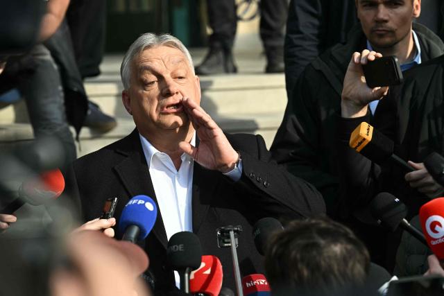 Hungarian Prime Minister Viktor Orban talks with journalists after he voted at a polling station set up in a school of the 12th district in Budapest during a general election in Hungary, on April 12, 2026. The vote could end Hungarian Prime Minister Viktor Orban's 16-year stint in power as the EU's longest serving current leader and a self-decribed "thorn" in the bloc's side. (Photo by Attila KISBENEDEK / AFP)