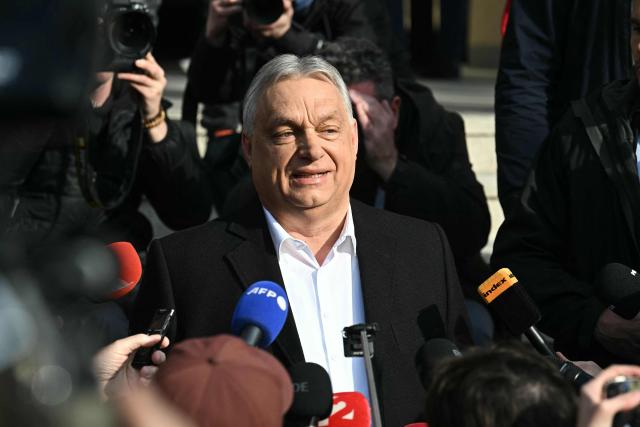Hungarian Prime Minister Viktor Orban talks with journalists after he voted at a polling station set up in a school of the 12th district in Budapest during a general election in Hungary, on April 12, 2026. The vote could end Hungarian Prime Minister Viktor Orban's 16-year stint in power as the EU's longest serving current leader and a self-decribed "thorn" in the bloc's side. (Photo by Attila KISBENEDEK / AFP)