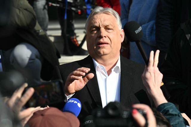 Hungarian Prime Minister Viktor Orban talks with journalists after he voted at a polling station set up in a school of the 12th district in Budapest during a general election in Hungary, on April 12, 2026. The vote could end Hungarian Prime Minister Viktor Orban's 16-year stint in power as the EU's longest serving current leader and a self-decribed "thorn" in the bloc's side. (Photo by Attila KISBENEDEK / AFP)