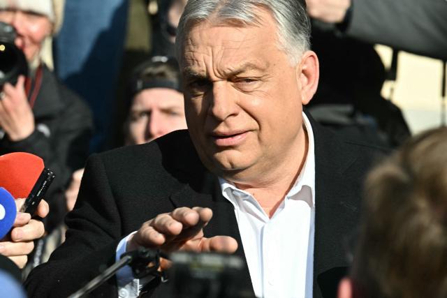 Hungarian Prime Minister Viktor Orban talks with journalists after he voted at a polling station set up in a school of the 12th district in Budapest during a general election in Hungary, on April 12, 2026. The vote could end Hungarian Prime Minister Viktor Orban's 16-year stint in power as the EU's longest serving current leader and a self-decribed "thorn" in the bloc's side. (Photo by Attila KISBENEDEK / AFP)