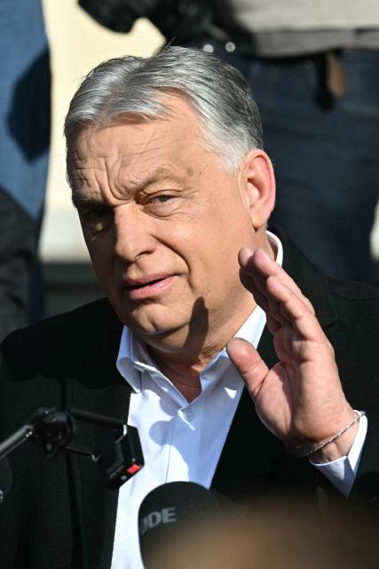 Hungarian Prime Minister Viktor Orban talks with journalists after he voted at a polling station set up in a school of the 12th district in Budapest during a general election in Hungary, on April 12, 2026. The vote could end Hungarian Prime Minister Viktor Orban's 16-year stint in power as the EU's longest serving current leader and a self-decribed "thorn" in the bloc's side. (Photo by Attila KISBENEDEK / AFP)