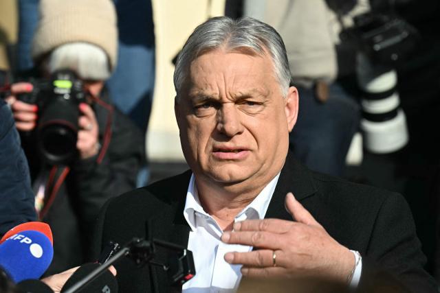 Hungarian Prime Minister Viktor Orban talks with journalists after he voted at a polling station set up in a school of the 12th district in Budapest during a general election in Hungary, on April 12, 2026. The vote could end Hungarian Prime Minister Viktor Orban's 16-year stint in power as the EU's longest serving current leader and a self-decribed "thorn" in the bloc's side. (Photo by Attila KISBENEDEK / AFP)