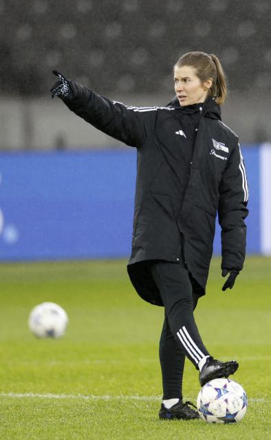 (ALTERNATIVE CROP) Union Berlin's assistant coach Marie-Louise Eta oversees a training session in Berlin on December 11, 2023, on the eve of their UEFA Champions League Group C match against Real Madrid CF. Bundesliga club Union Berlin have named Marie-Louise Eta as manager, making her the first female head coach in Bundesliga history, after Steffen Baumgart was sacked on April 12, 2026. Eta becomes the first female top-flight coach of a men's team in a major European league. The 34-year-old, who was the first female assistant coach in the Bundesliga, will take over for the remainder of the season. (Photo by Odd ANDERSEN / AFP) / ALTERNATE CROP