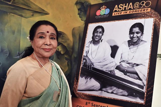 (FILES) Bollywood playback singer Asha Bhosle attends a press conference in Mumbai on August 8, 2023, to announce her 90th Live concert in Dubai. Bhosle, one of India's most iconic playback singers and a two-time Grammy nominee, died on April 12, 2026 in Mumbai aged 92, her family said. (Photo by Sujit JAISWAL / AFP)