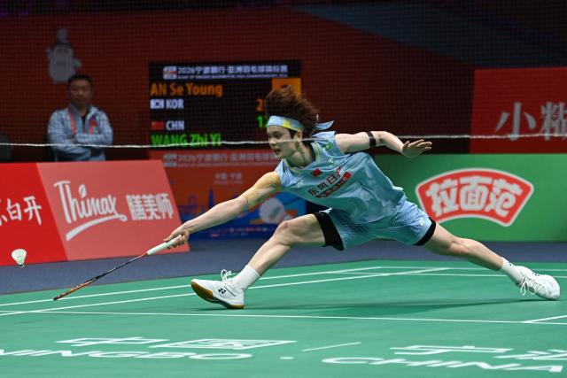China's Wang Zhiyi hits a return to South Korea's An Se-young during their women's singles final match at the Badminton Asia Championship in Ningbo, eastern China's Zhejiang province on April 12, 2026. (Photo by CN-STR / AFP) / China OUT