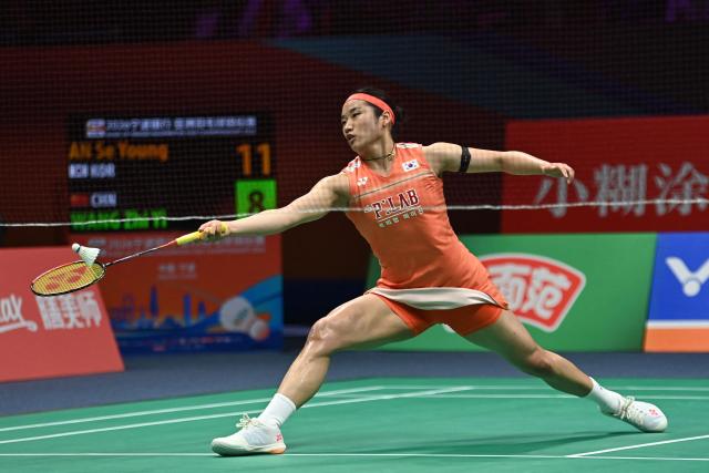 South Korea's An Se-young hits a return to China's Wang Zhiyi during their women's singles final match at the Badminton Asia Championship in Ningbo, eastern China's Zhejiang province on April 12, 2026. (Photo by CN-STR / AFP) / China OUT