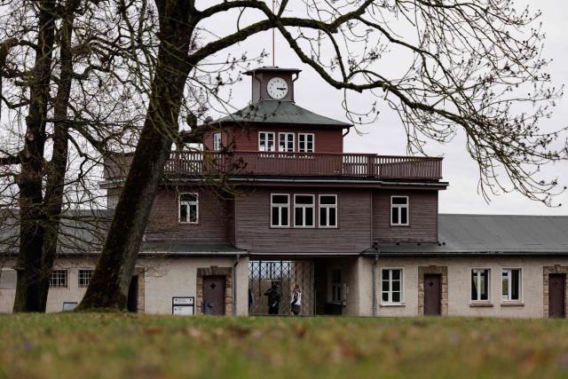 The main gate of the Buchenwald Nazi concentration camp memorial site is pictured on April 12, 2026, prior to the commemoration ceremony to mark the 81th anniversary of the liberation of the Buchenwald Nazi concentration camp at the camp's memorial site near Weimar, eastern Germany. From 1937 to 1945, almost 280,000 victims of the Nazis were imprisoned in Buchenwald concentration camp and its satellite camps; more than 56,000 were murdered or died as a result of inhumane conditions. Among the prisoners were Jews, Roma, domestic political opponents of the Nazis, and forced laborers from Eastern Europe. Buchenwald is one of the most symbolically significant and best-known former concentration camps in Germany. (Photo by JENS SCHLUETER / AFP)