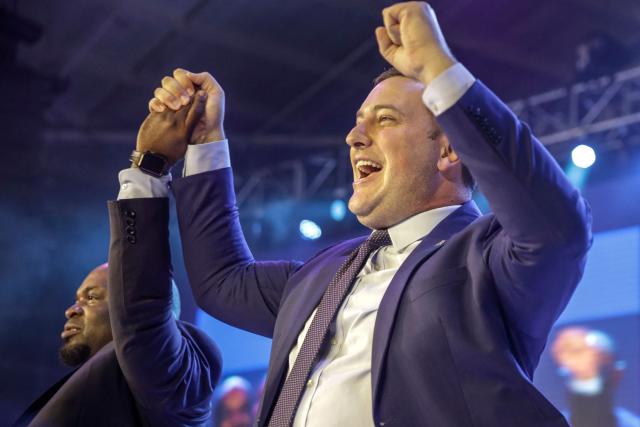 Newly elected federal leader of the Democratic Alliance (DA) Geordin Hill-Lewis (R) and newly elected federal chairperson of the Democratic Alliance (DA) federal chairperson Solly Msimanga (L) celebrate on the second day of the DA Federal Congress at the Gallagher Convention Centre in Midrand on April 12, 2026. (Photo by Ilaria Finizio / AFP)