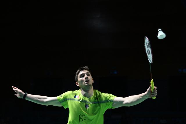 France’s Christo Popov hits a return to Denmark’s Anders Antonsen during their men’s singles semifinal match of the Badminton European Championships' finale at the Carolina Marin Sports Palace in Huelva on April 12, 2026. (Photo by Cristina Quicler / AFP)