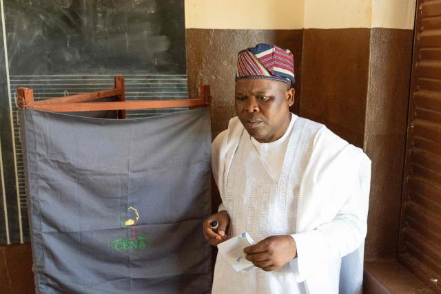 Presidential candidate Paul Hounkpe leaves a voting booth at a polling station in Lobogo on April 12, 2026 during Benin's presidential election. (Photo by Yanick Folly / AFP)