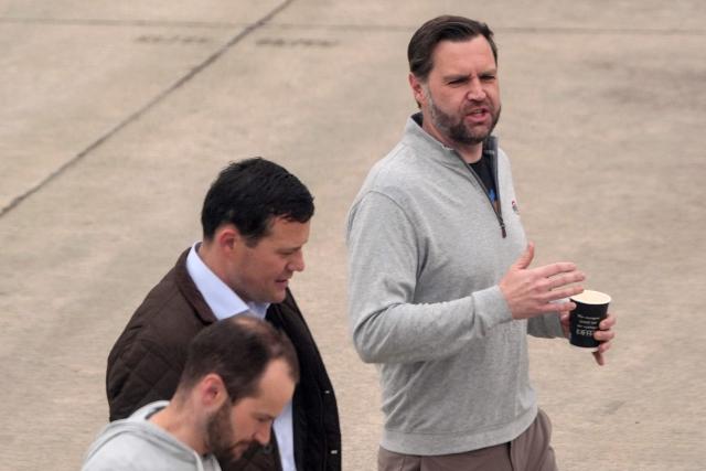 US Vice President JD Vance (R) walks across the tarmac during a scheduled refuelling stop at Ramstein Air Base in Germany on April 12, 2026 following his departure from Islamabad after talks on Iran. Iran and the United States failed to strike a deal on April 12 to end the war in the Middle East, but there was no immediate return to hostilities and the region clung to hope that a fragile truce would hold. (Photo by Jacquelyn Martin / POOL / AFP)