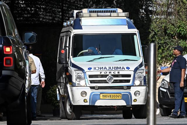 An ambulance carrying the body of Bollywood playback singer Asha Bhosle arrives at her residence Casa Grande in Mumbai on April 12, 2026. Legendary Indian playback singer Bhosle, whose voice defined Bollywood music through the 1970s and 80s, died on April 12 in Mumbai aged 92, her family said. (Photo by Sujit JAISWAL / AFP)