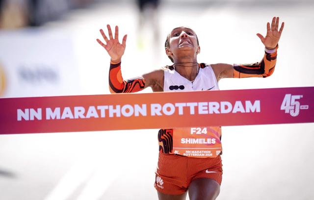 Ethiopia's Mekides Shimeles reacts as she winf the women’s race of the 45th edition of the Rotterdam Marathon in Rotterdam on April 12, 2026. (Photo by Robin van Lonkhuijsen / ANP / AFP) / Netherlands OUT