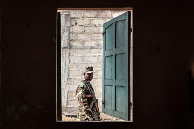 A Benin soldier looks on as he patrols at a primary school serving as a polling station in Cotonou, on April 12, 2026 during Benin's presidential election. (Photo by OLYMPIA DE MAISMONT / AFP)