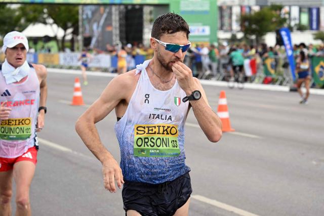 Italy's Ricardo Orsoni and France's Aureliene Quinon compete in the World Athletics Race Walking Team Championships men's marathon, in Brasilia, on April 12, 2026. (Photo by Evaristo SA / AFP)