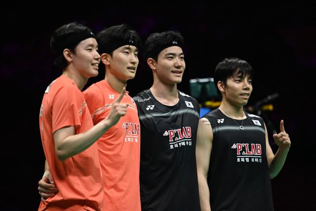 (R-L) South Korea´s Seo Seung-jae, Kim Won-ho, Kang Min-hyuk and Ki Dong-ju pose after their men's doubles final match at the Badminton Asia Championship in Ningbo, eastern China's Zhejiang province on April 12, 2026. South Korea´s Seo Seung-jae, Kim Won-ho won the match. (Photo by CN-STR / AFP) / China OUT